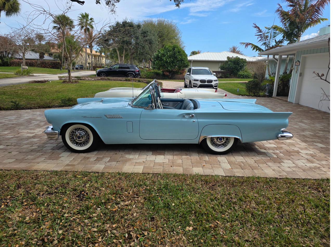 Tim's Automotive garage bays with classic cars — black and white photo